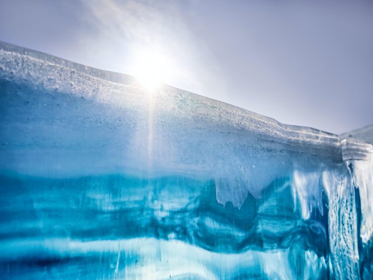 a blue glacier under the sun
